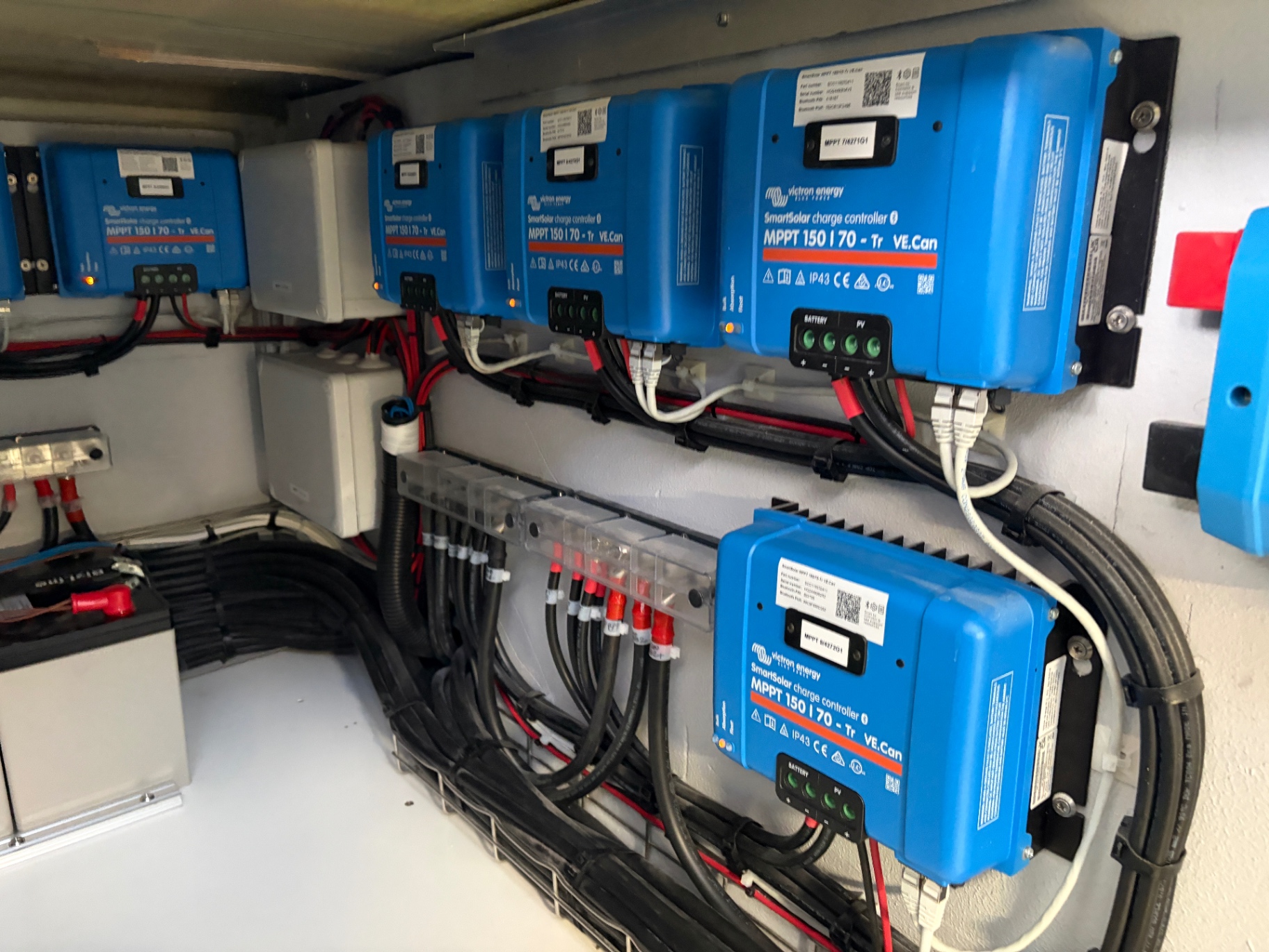 Bank of Victron SmartSolar MPPT 150/70 charge controllers installed on a superyacht