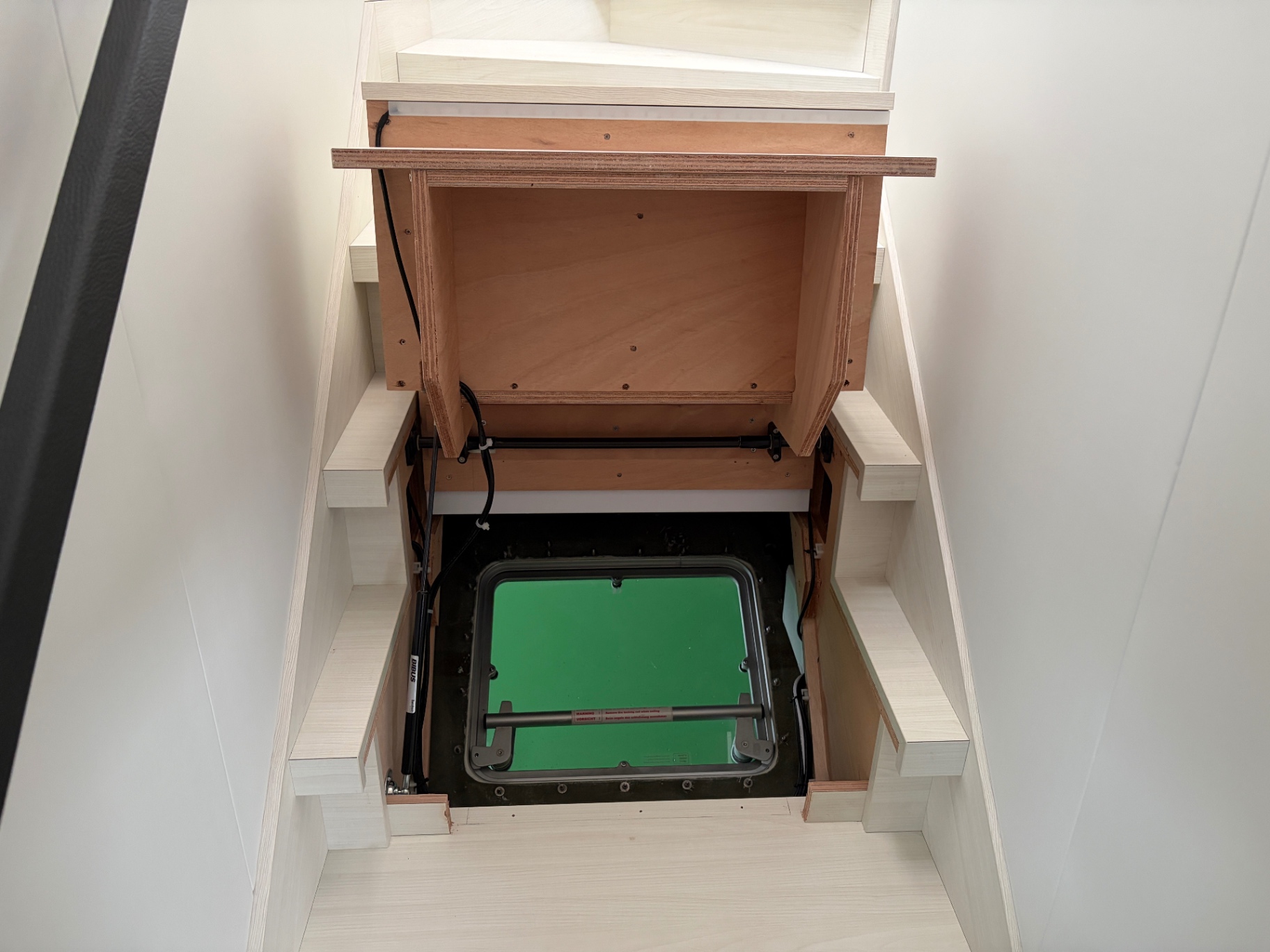 Emergency escape hatch under companionway step — operation check